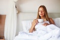 Woman having coffee in a bed Royalty Free Stock Photo