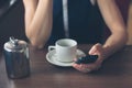 Woman having coffee and using smartphone Royalty Free Stock Photo