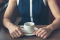 Woman having coffee by the window in a diner Royalty Free Stock Photo