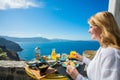 Woman having delicious breakfast in luxurious resort in Mediterranean Royalty Free Stock Photo