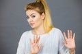 Woman deny something showing stop gesture with hands Royalty Free Stock Photo