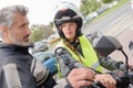 Woman having driving lesson on motorcycle Royalty Free Stock Photo