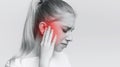 Woman having ear pain, touching her painful head Royalty Free Stock Photo