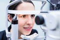 Woman having eyes measured with test device Royalty Free Stock Photo