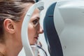 Woman having eyesight test using modern refractometer Royalty Free Stock Photo