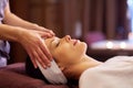 Woman having face and head massage at spa Royalty Free Stock Photo