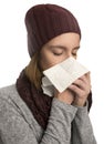 Woman having flu, feeling bad and blowing her nose Royalty Free Stock Photo