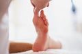 Woman having foot reflexology massage in salon Royalty Free Stock Photo