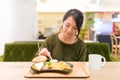 Woman having French fries in restaurant Royalty Free Stock Photo