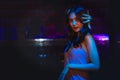 Woman having fun dancing at night disco club with neon light Royalty Free Stock Photo