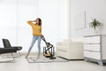 Woman having fun while vacuuming at home Royalty Free Stock Photo