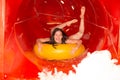 Woman having fun in water slide Royalty Free Stock Photo