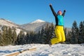 Woman having fun in winter mountains Royalty Free Stock Photo