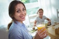 Woman having a glass of orange juice at home Royalty Free Stock Photo