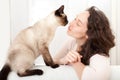 Woman having good times at home with cat Royalty Free Stock Photo