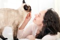 Woman having good times at home with cat Royalty Free Stock Photo