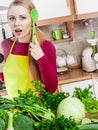 Woman having green vegetables thinking about cooking Royalty Free Stock Photo