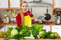 Woman having green vegetables thinking about cooking Royalty Free Stock Photo