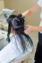 Woman having hair done by hairdresser Royalty Free Stock Photo