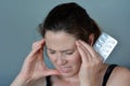 Woman having headache taking pills Royalty Free Stock Photo