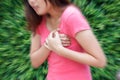 Woman having heart attack at outdoor - Angina Pectoris, Myocardial Infarction. Royalty Free Stock Photo