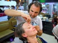 Woman having her eyebrows threaded