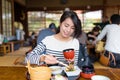 Woman having japanese meal in restaurant