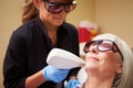 Woman Having Laser Treatment At Beauty Clinic