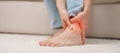 woman having leg pain due to Ankle Sprains or Achilles Tendonitis and Shin Splints ache. injuries, health and medical concept