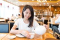 Woman having meal in chinese restaurant Royalty Free Stock Photo