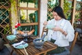 Woman having a meal of thai food with tom yum soup in a restaurant Royalty Free Stock Photo