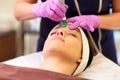 Woman having microdermabrasion facial treatment Royalty Free Stock Photo