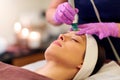 Woman having microdermabrasion facial treatment Royalty Free Stock Photo