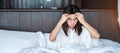 Woman having migraine headaches during lying in bed at home. insomnia, sleepless, tired, suffering and stressed concepts Royalty Free Stock Photo