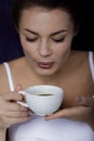 Woman having morning coffee in bed Royalty Free Stock Photo