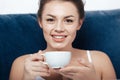 Woman having morning coffee in bed Royalty Free Stock Photo