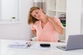 Woman Having Neckache At Desk