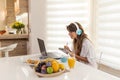 Woman having online meeting while working from home Royalty Free Stock Photo