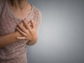 Woman having a pain in the heart attract. Royalty Free Stock Photo