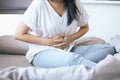 Woman having painful stomachache standing in the bedroom,Female suffering from abdominal pain Royalty Free Stock Photo