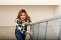 Woman having panic attack while walking upstairs