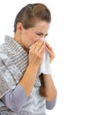 Woman having running nose and using napkin