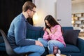 Woman having session with psychologist, sitting on couch at clinic. The woman is very upset, the psychotherapist is trying to help Royalty Free Stock Photo