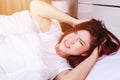 woman having sleepless on bed and having migraine,stress, insomnia, hangover in bedroom Royalty Free Stock Photo