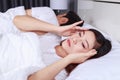 woman having sleepless on bed and having migraine,stress, insomnia, hangover in bedroom Royalty Free Stock Photo