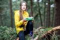 Woman having a snack in the forest Royalty Free Stock Photo