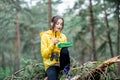 Woman having a snack in the forest Royalty Free Stock Photo