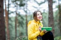 Woman having a snack in the forest Royalty Free Stock Photo