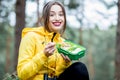 Woman having a snack in the forest Royalty Free Stock Photo