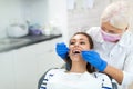 Dentist and patient in dentist office